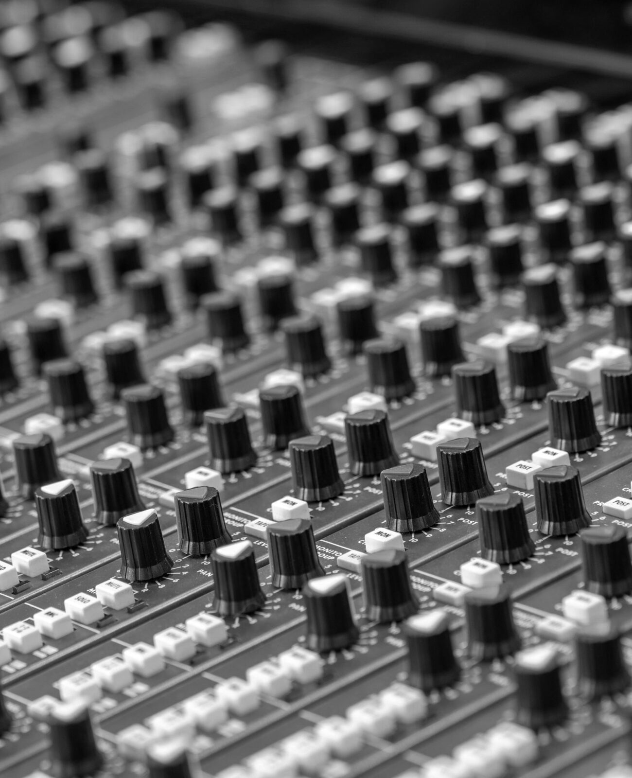 Closeup of a mixing desk's channels.
